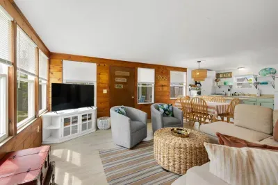 Unwind in the comfortable living room, complete with a Roku TV for endless streaming entertainment.