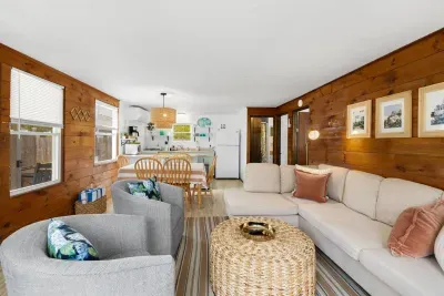 Enjoy this nice living room space, complete with a dining table and a well-appointed kitchen, all designed for easy gathering.