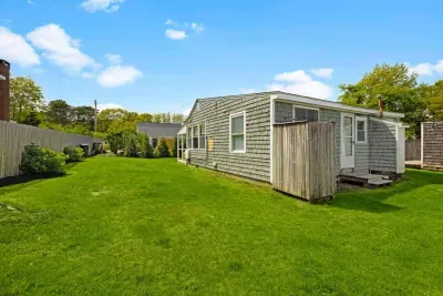 An outdoor shower is available, perfect for rinsing off after a day at the beach.