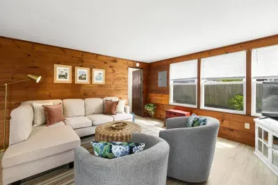 A big couch for the entire family is complemented by two individual seat couches.