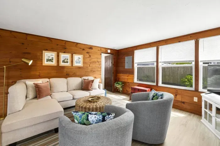 A big couch for the entire family is complemented by two individual seat couches.
