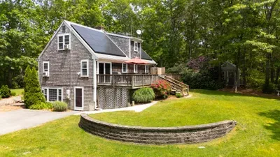 Private wooded retreat with sunny deck and spacious green lawn