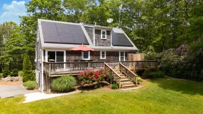 Private wooded retreat with sunny deck, large yard, and eco-friendly solar panels