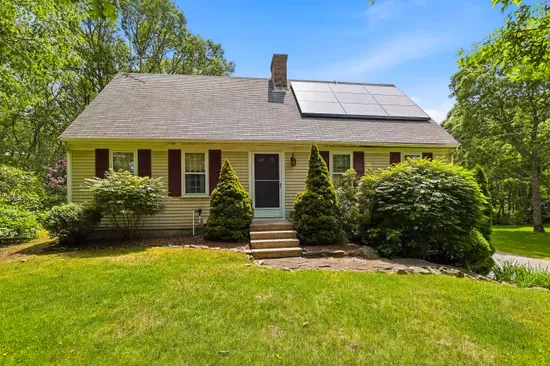 Charming cottage with lush yard, wooded privacy, and eco-friendly solar