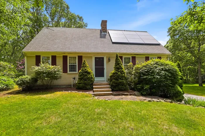 Charming cottage with lush yard, wooded privacy, and eco-friendly solar