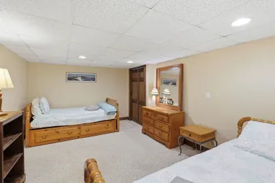 Spacious bedroom with cozy wood furnishings and ample storage