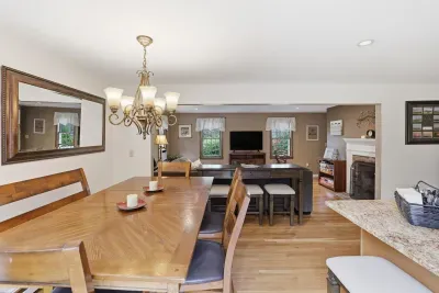 From breakfast at the island to dinner by the fire, stay connected in this warm, open heart of the home.