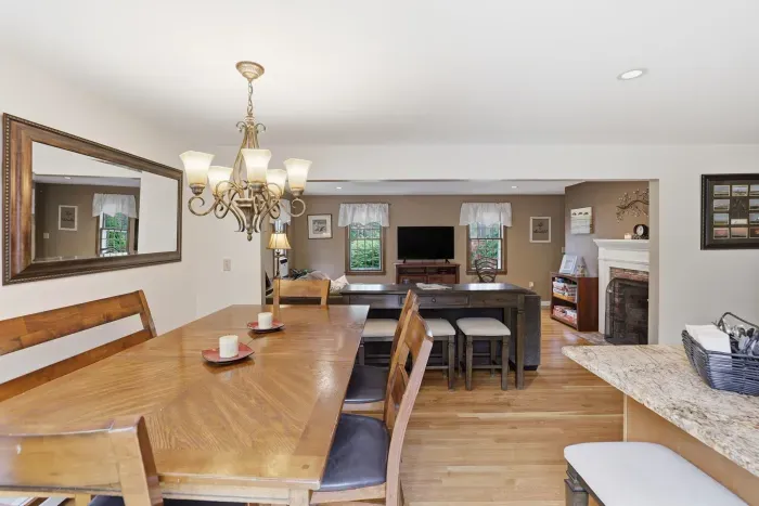 From breakfast at the island to dinner by the fire, stay connected in this warm, open heart of the home.