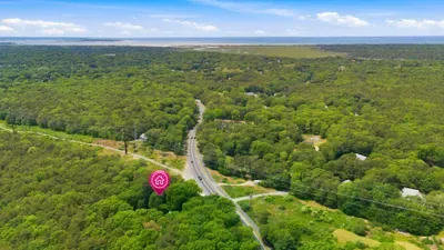 Peaceful wooded setting with scenic coastal views nearby