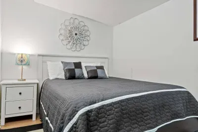 Stylish bedroom with cozy bedding and bright decor