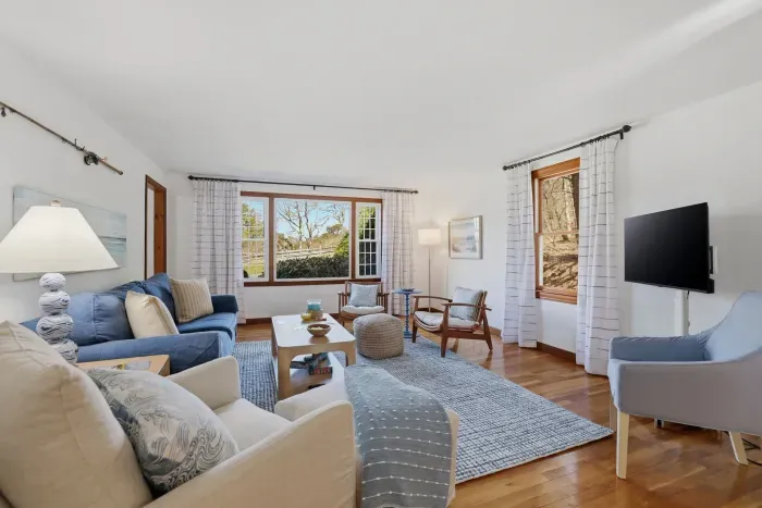 Your front-row seat to the changing light. This airy sanctuary blends the timeless warmth of wood with the kind of cozy seating that makes "staying in" the best part of your trip.