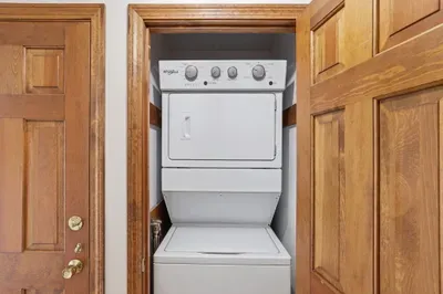 In‑unit stacked washer/dryer—compact laundry convenience.