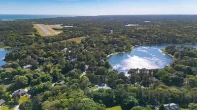 Scenic aerial views with pond, forested surroundings, and nearby coast
