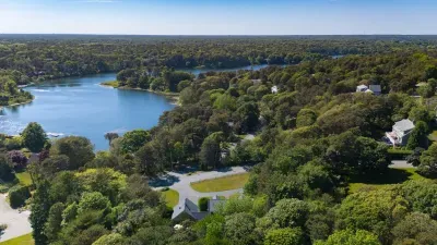 Peaceful wooded setting near the water with scenic neighborhood views