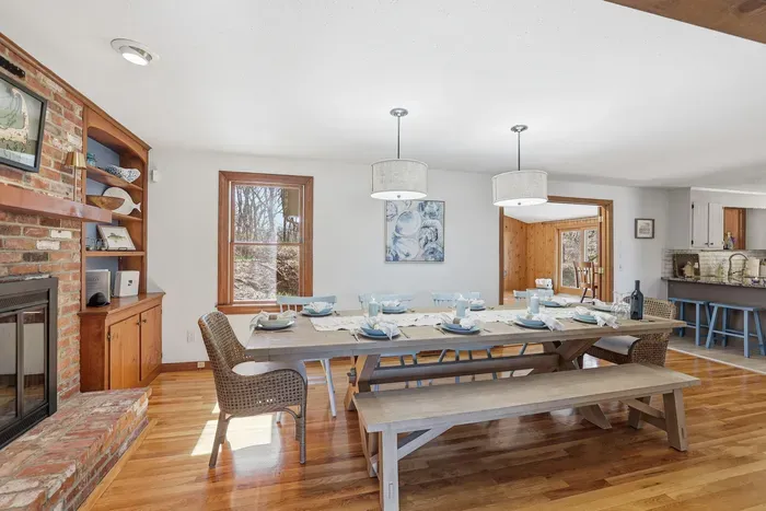 Dinner served with a side of glow. Whether it’s a holiday spread or a casual takeout night, the crackling fireplace and airy open layout make every meal feel like a special event.