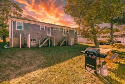 Spacious yard with gas BBQ grill, picnic table, fire pit & sunset vibes