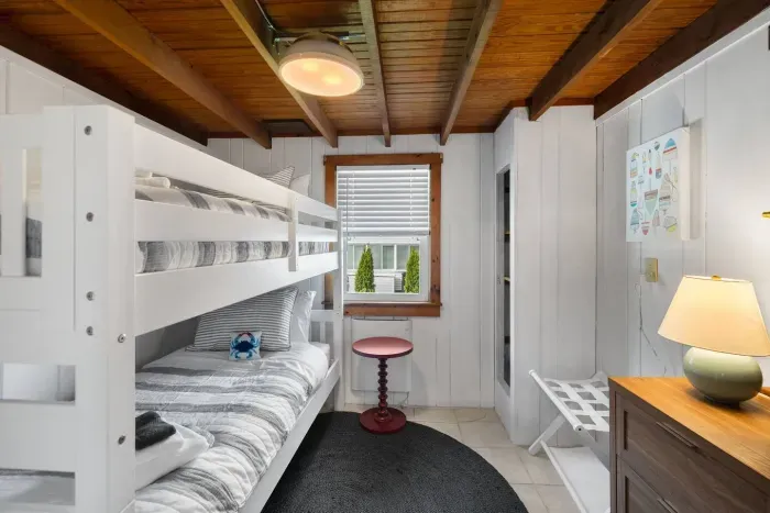 Front unit: This charming bedroom features a twin bunk bed, making it ideal for kids to have their own cozy haven during your stay.