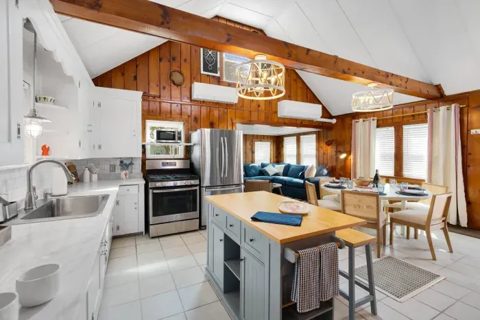 Front unit: prepare and enjoy your meals together right here at the house, table and isle kitchen