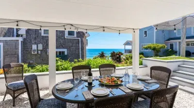 Ocean views, coastal vibes, and the perfect location. Situated in the heart of Falmouth Heights, you're steps from the beach and right on the path of the famous August Road Race.