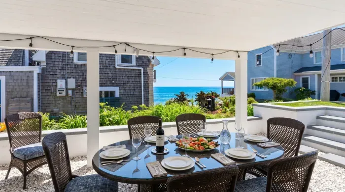Ocean views, coastal vibes, and the perfect location. Situated in the heart of Falmouth Heights, you're steps from the beach and right on the path of the famous August Road Race.