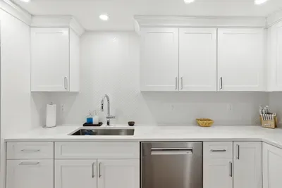 Bright modern kitchen with quartz counters and sleek stainless finishes