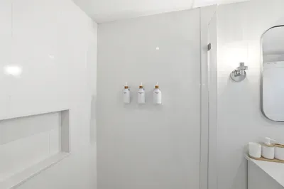 Bright modern bathroom with sleek walk-in shower and spa-like touches