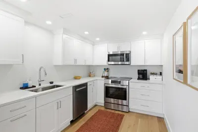 Bright modern kitchen with stainless appliances and ample prep space