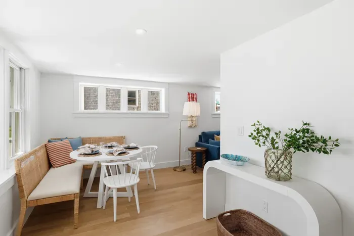Bright dining nook with cozy banquette seating and natural light
