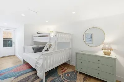 Bright family-friendly bunk room with stylish coastal touches