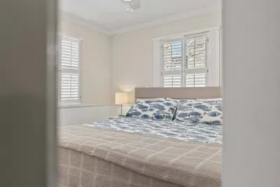 Enjoy the calming decor of the spacious bedroom.