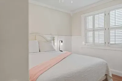 Soft, bright ambiance and comfortable Queen bed.