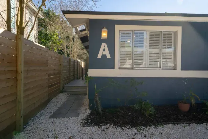 Look for the charming blue exterior and clear signage for Unit A
