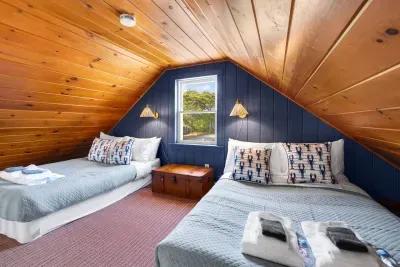 Discover the versatile loft space, complete with two full beds that comfortably accommodate four more guests – an ideal setup for larger parties.