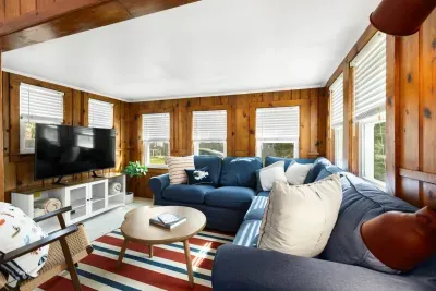 Unwind in the spacious living room, complete with a plush sectional sofa perfect for lounging and a 46" Samsung Smart TV for all your entertainment needs.