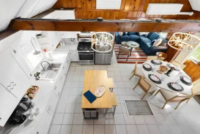 The kitchen seamlessly flows into the dining space, perfect for cooking, sharing meals, and gathering together.