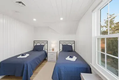 Perfect for kids or friends! This cozy, bright room features two comfortable twin beds.