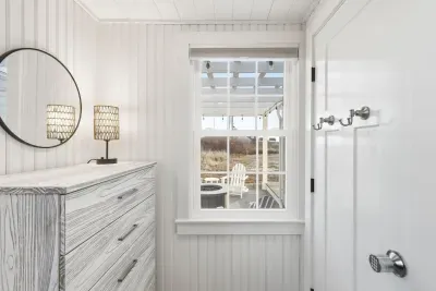 Hear the gentle crackle! The 3rd bedroom provides a truly unique experience with instant access to the outdoor haven. Curl up inside with a good book, or step out to the fire pit under the stunning pergola for s'mores and starry nights.