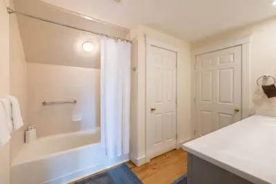 Upstairs bathroom with the added convenience of a separate toilet room for enhanced privacy.
