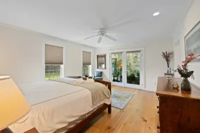 Spacious room with access to/a view of your own secluded green nook, perfect for a moment of tranquility before bed