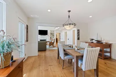 Effortless entertaining! The open flow from the kitchen leads to this convenient dining nook, perfect for casual meals and conversations with seating for four.