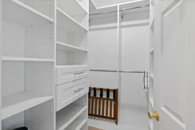 Enjoy the convenience of a spacious walk-in closet directly connected to the primary bedroom, offering ample storage for your belongings.