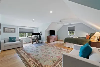 Whether you're looking to relax with some entertainment or need a productive spot for work, this room seamlessly blends comfort with a dedicated workspace.