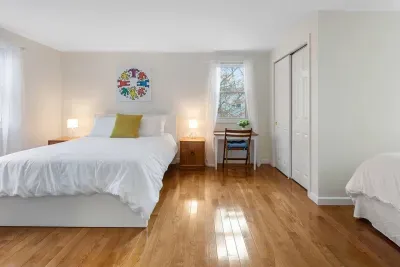 Modern comfort meets Cape charm. One of our spacious second-floor rooms.