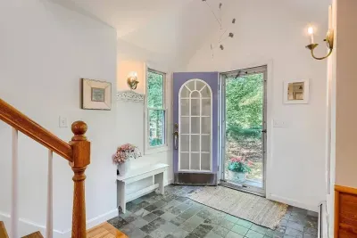 Front door. Our living room is the definition of cozy coastal charm!