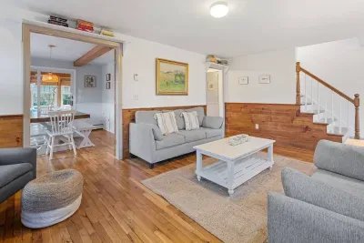 Welcome home! With two comfortable sofas, a fireplace, and an open flow to the dining area