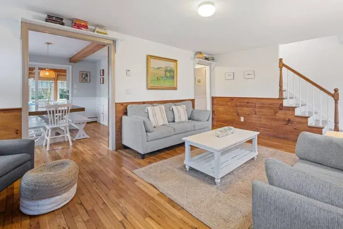 Welcome home! With two comfortable sofas, a fireplace, and an open flow to the dining area