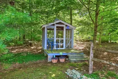 The screened in gazebo is perfect for an afternoon escape.