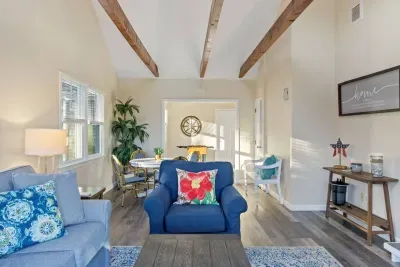 Meet the sunroom! This is the perfect spot for lounging, with a TV, a comfy sofa, and the best sunny view of the deck. Ideal for slow mornings.