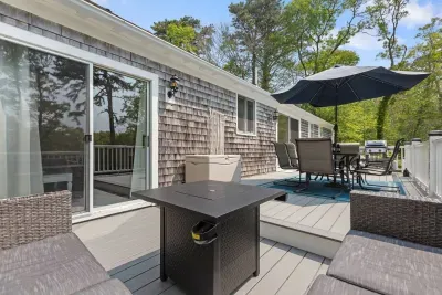 Plenty of shade, a spot for outdoor dining, and a cozy lounge area with fire pit