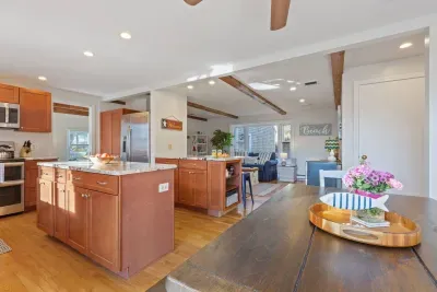 It has all the appliances you need, plus a huge island for prep and a breakfast bar for casual dining